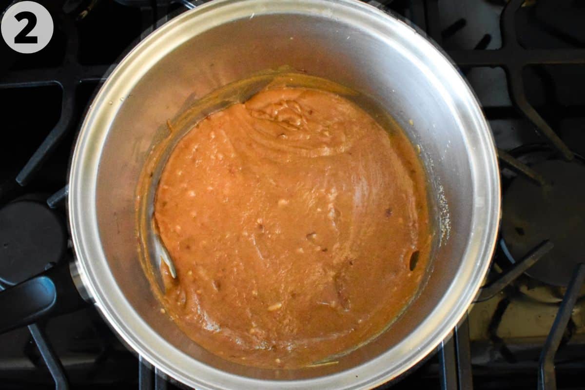 cooked peanut sauce in pot all smooth. 