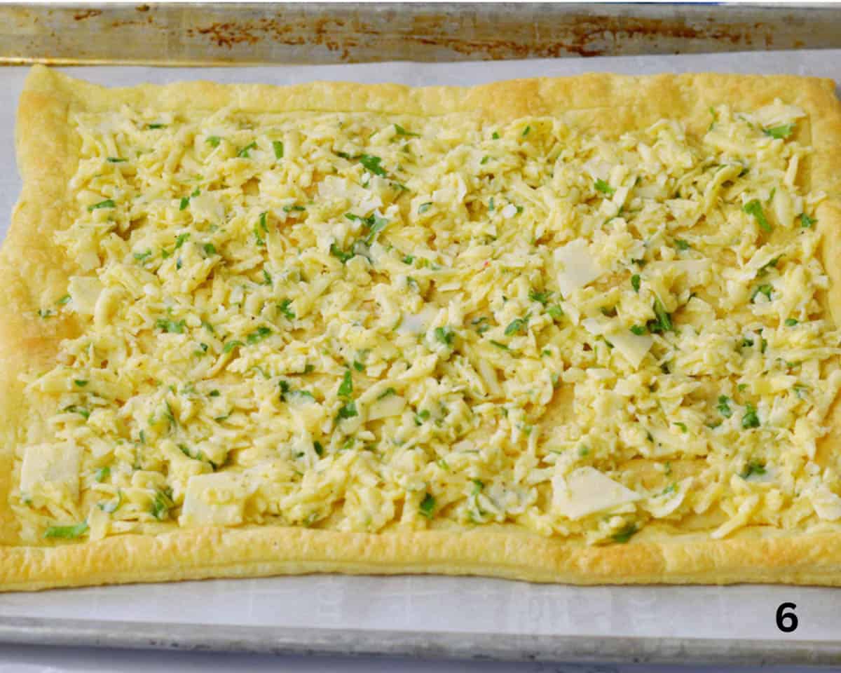 cheese mixture with herbs spread on puff pastry.