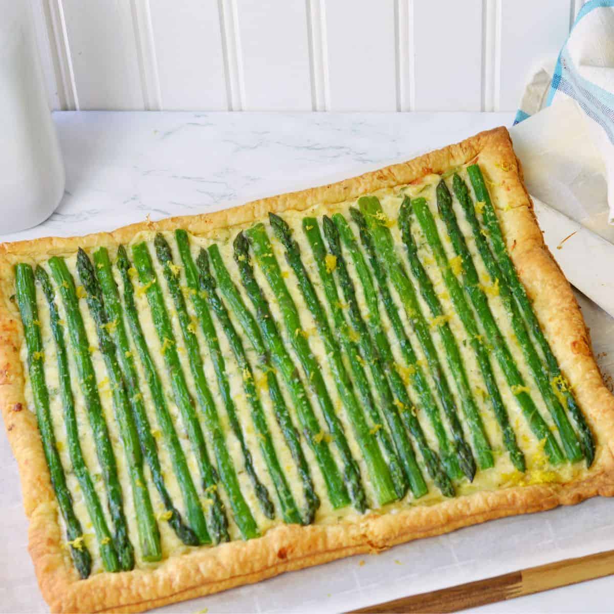 rectangle of puff pastry, cheese mixture and asparagus for featured image.