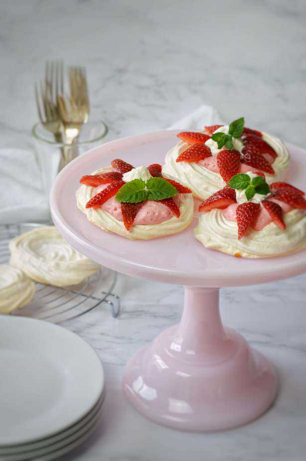 3 small meringue shells filled with strawberry mousse