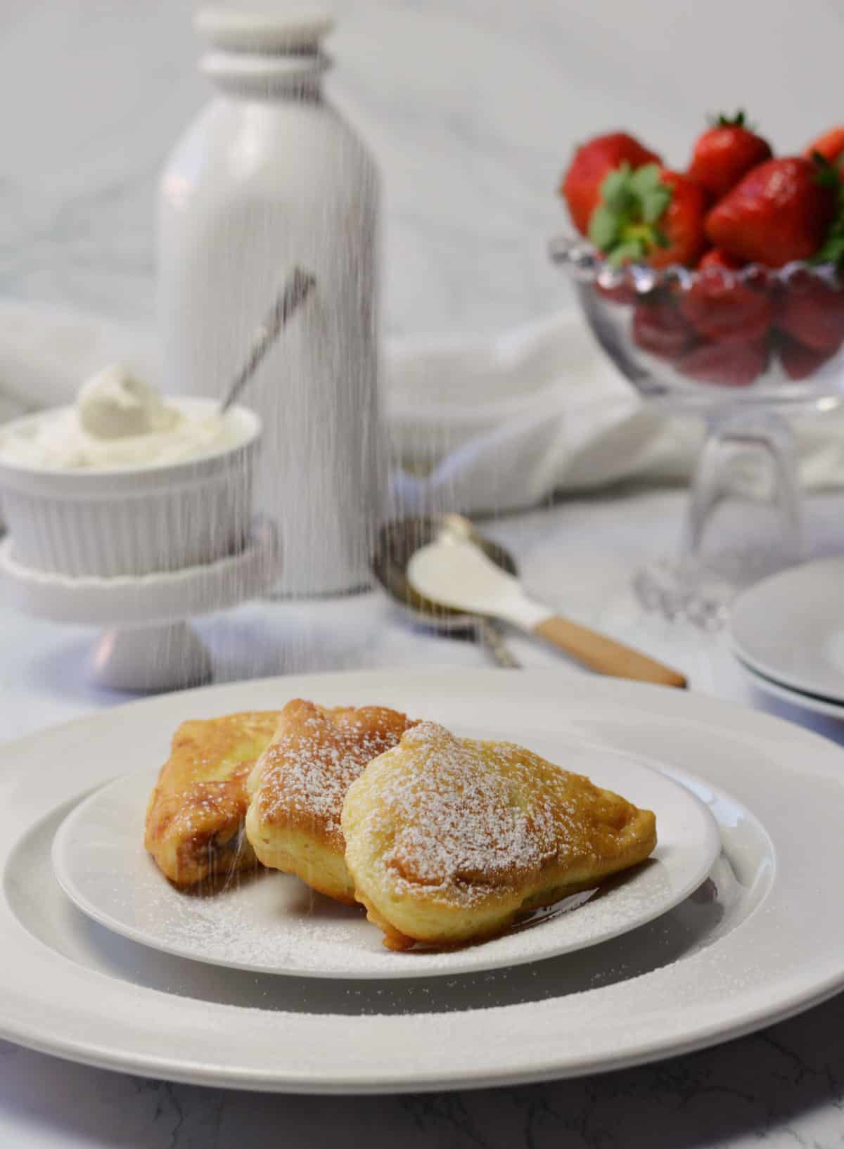 fluffy French toast dusted with powdered sugar.