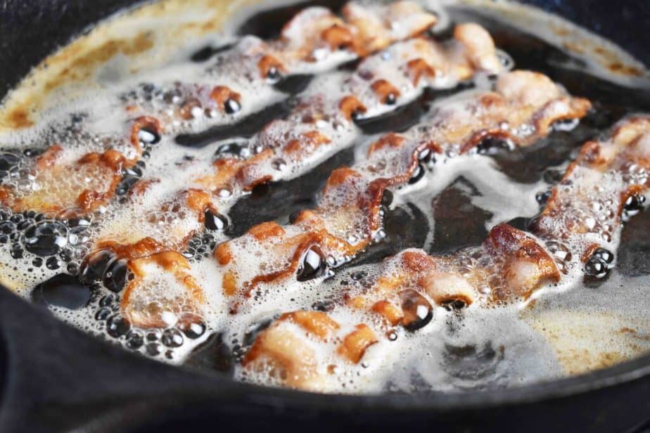 bubbling bacon in cast iron pan