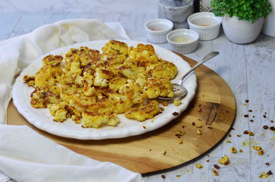 white platter with roasted curry cauliflower bites.
