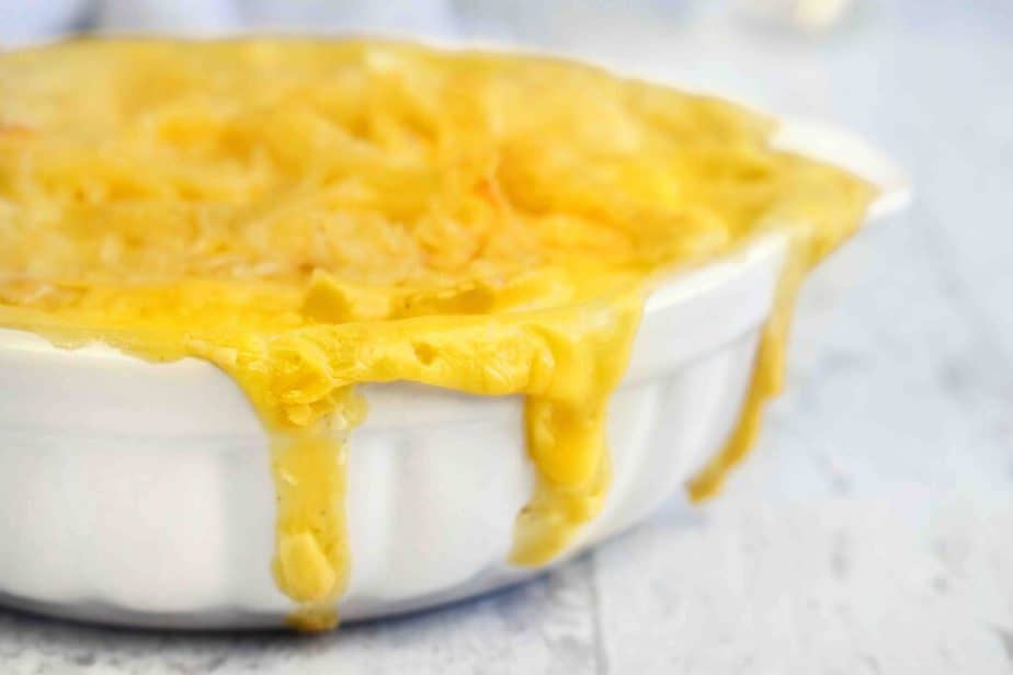baking dish with cheese dripping down the sides.