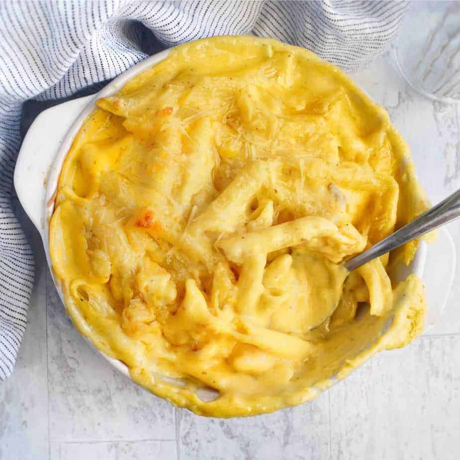 mac and cheese in casserole dish with spoon in dish
