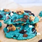blue monster cookie with bite out of it stacked.