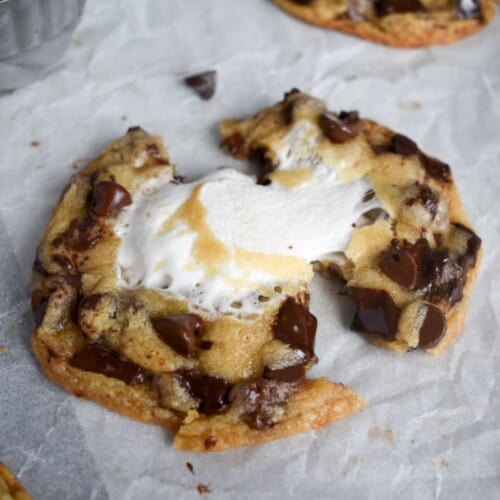 cookie being pulled apart with gooey marshmallow in it.