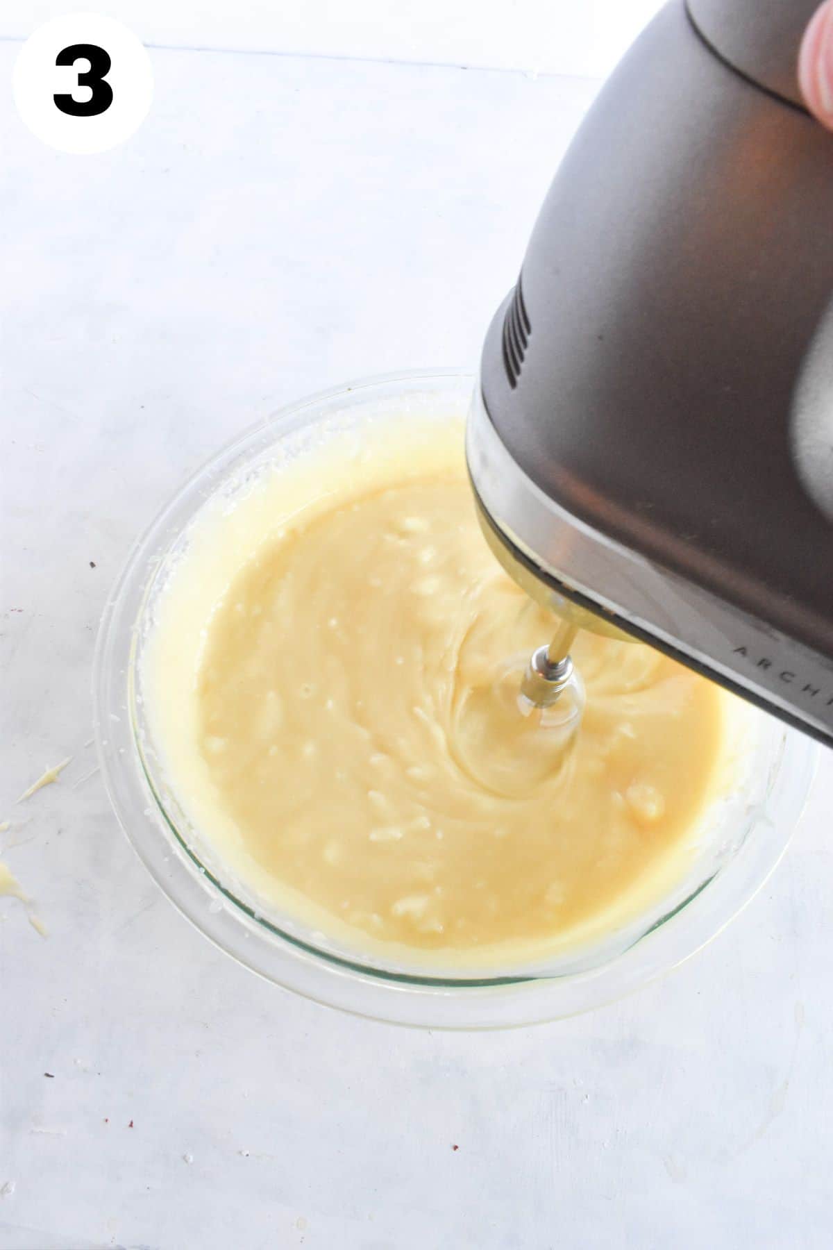 hand mixer showing how to mix cream cheese into pudding. 