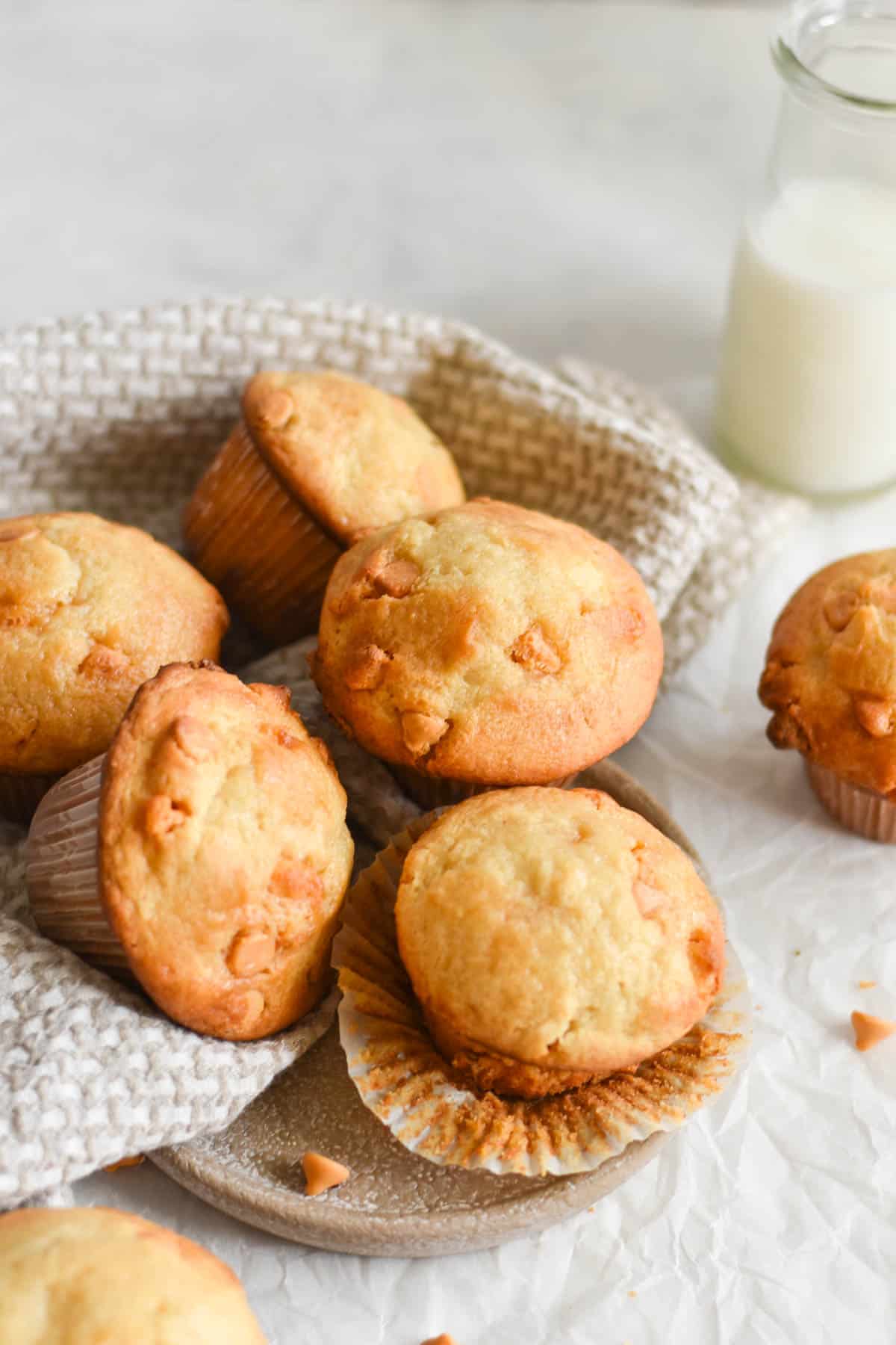 muffins piled together in a dish towel. 