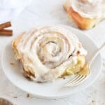 cinnamon roll on white plate.