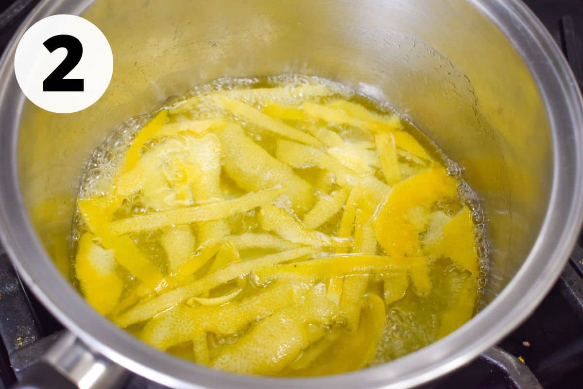 peels simmered in syrup in pot.