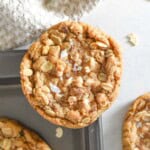 oatmeal cookie on corner of baking sheet.