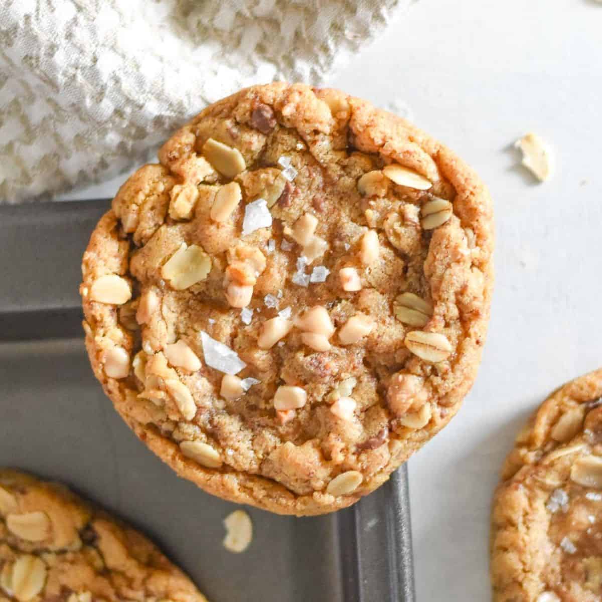oatmeal cookie on corner of baking sheet.