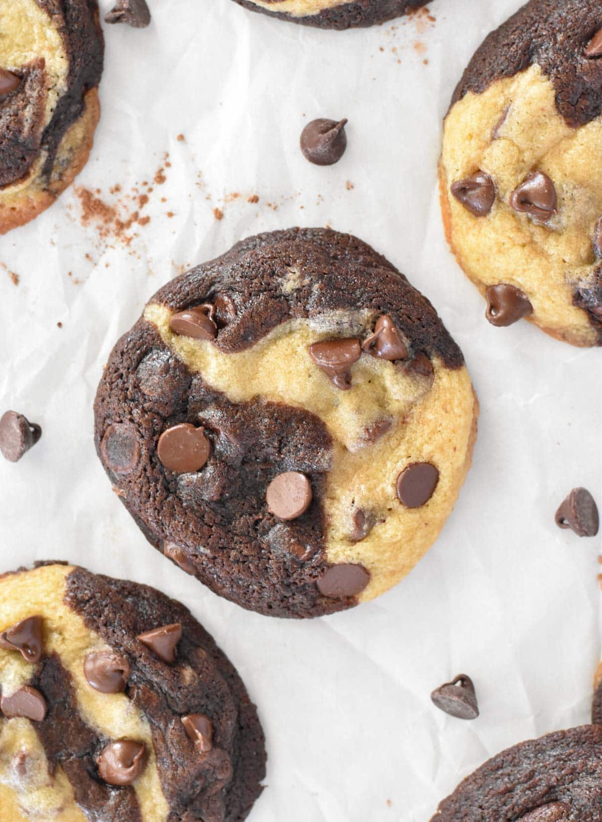 cookies spread out on white parchment paper.